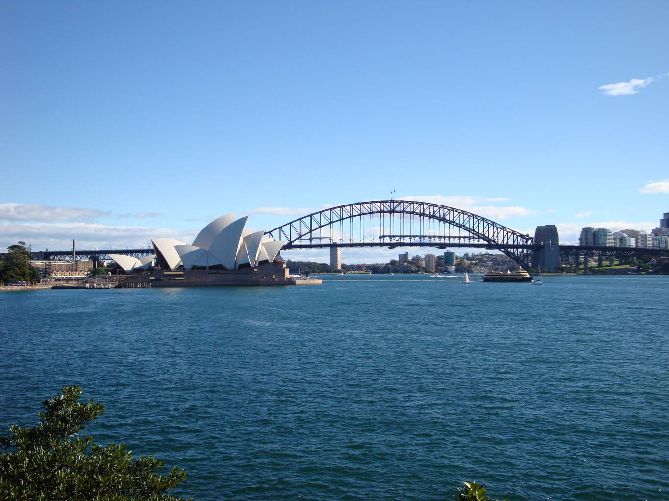 sydney harbor with view of the bridge and opera house