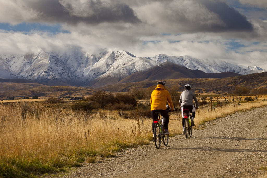 Cyclists on Otago Rail Trail near Oturehua, Central Otago, New Zealand.